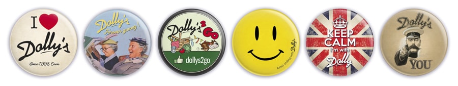 Déclinaison de l'identité visuelle et du logo du Dolly's 2 Go sur des badges